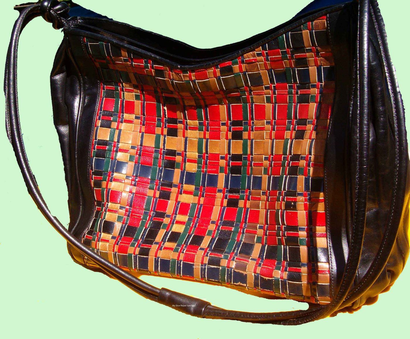 The same handbag with the strap repaired