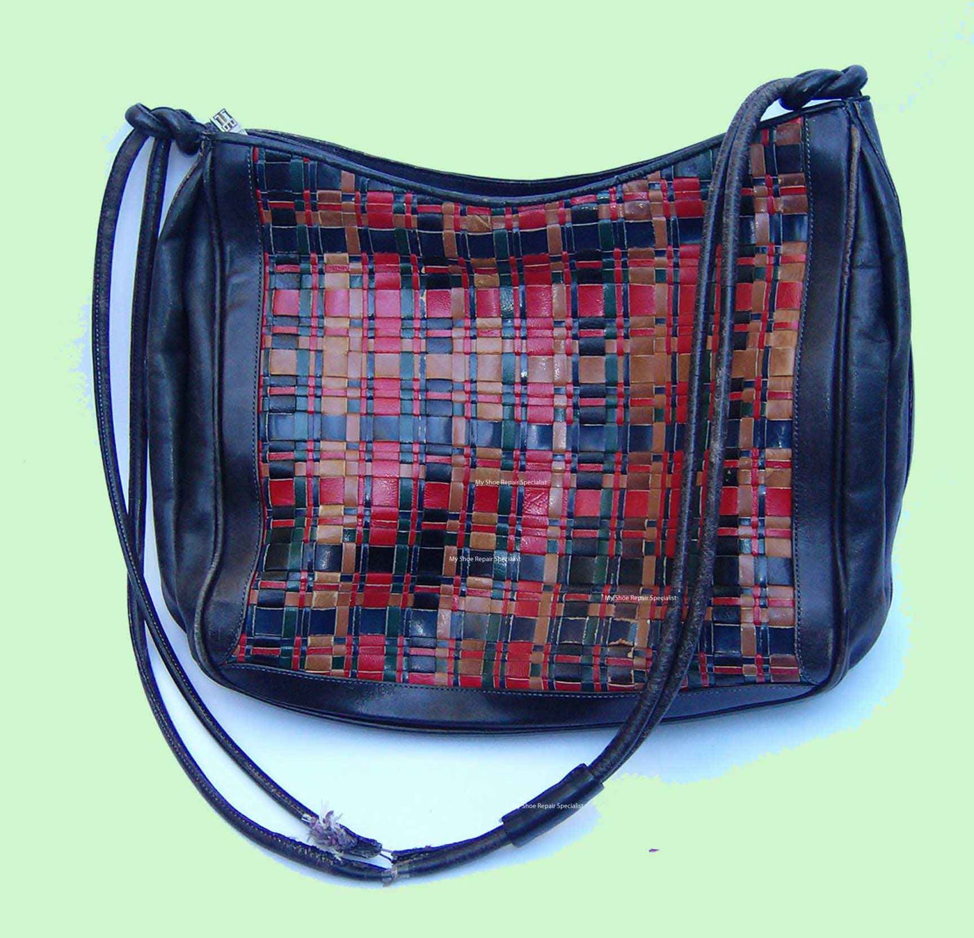 Leather handbag with a broken strap