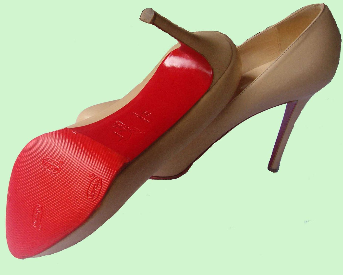 Christian Louboutin heel with a new red protective sole fitted by Keith