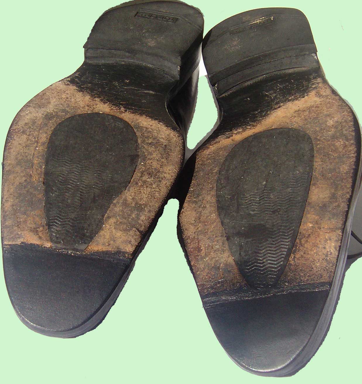 Pair of men's dress shoes with new heels and toe pieces